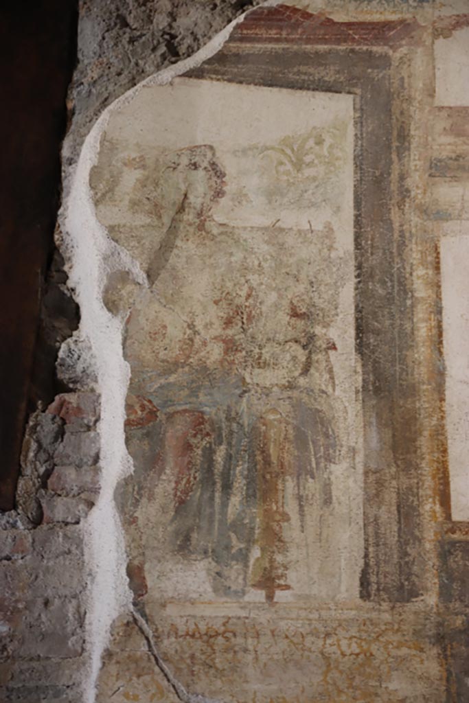 VI.15.1 Pompeii. October 2023.
Upper north wall of exedra, detail of central figure from above middle panel. Photo courtesy of Klaus Heese. 
