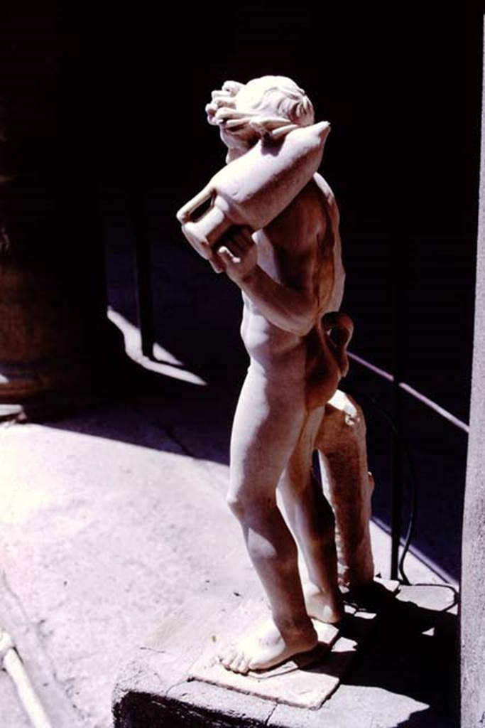 VI.15.1 Pompeii. 1977. Marble statue from north-east corner. Photo by Stanley A. Jashemski.   
Source: The Wilhelmina and Stanley A. Jashemski archive in the University of Maryland Library, Special Collections (See collection page) and made available under the Creative Commons Attribution-Non Commercial License v.4. See Licence and use details. J77f0557

