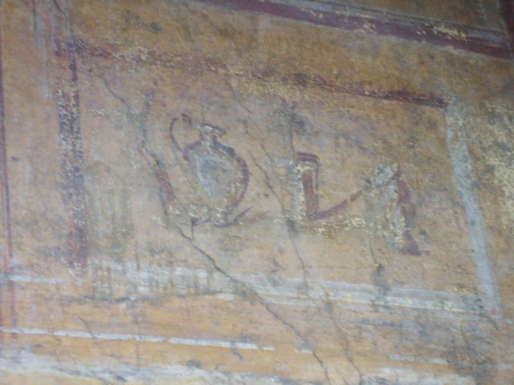 VI.16.7 Pompeii. May 2006. Room N, painting of jug and objects on east end of north wall.
