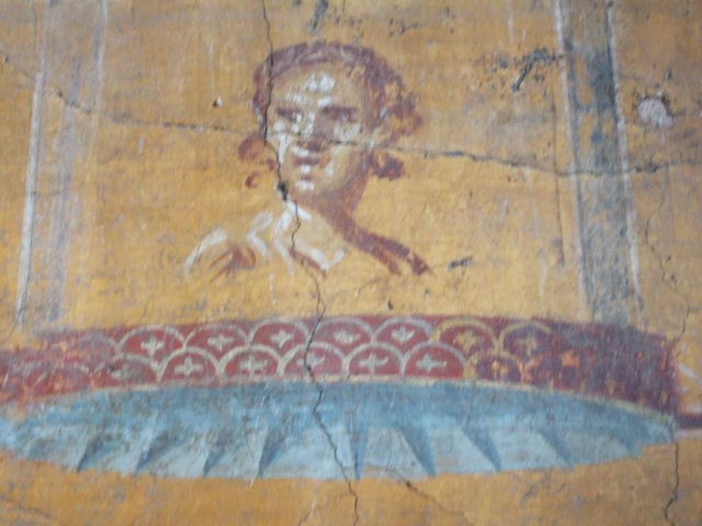 VI.16.7 Pompeii. May 2006. Room N, painting of face on south end of east wall.