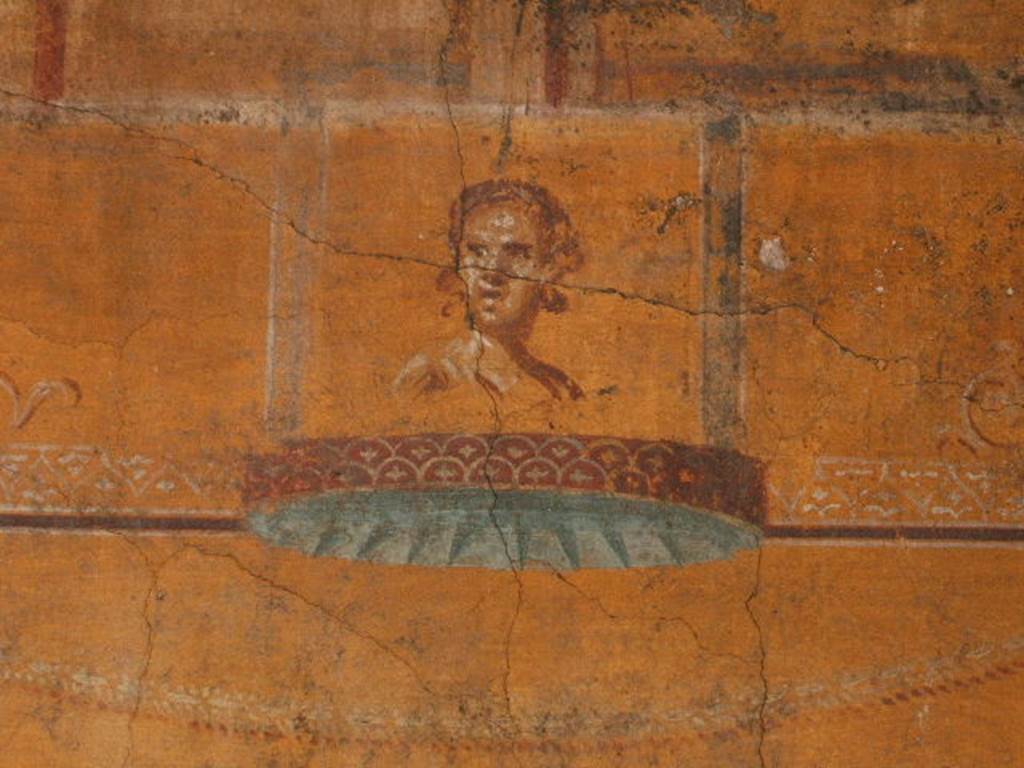 VI.16.7 Pompeii.  December 2004.  Room N, painting of face on south end of east wall.