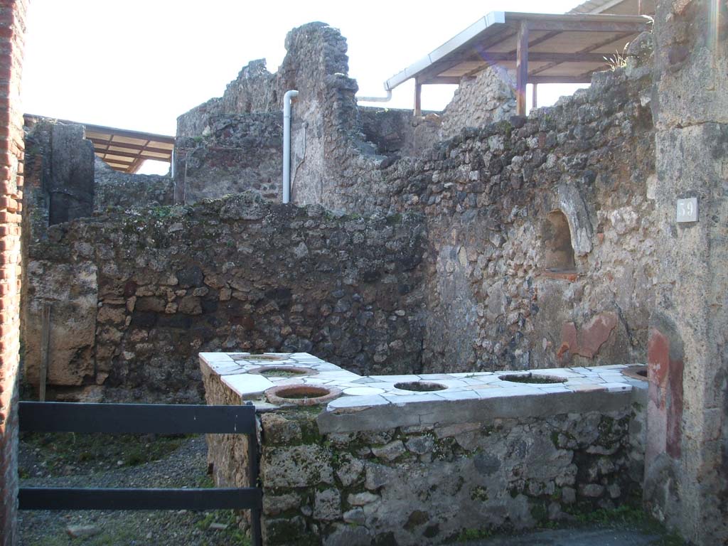 VII.1.39 Pompeii. December 2004. Looking south into bar.