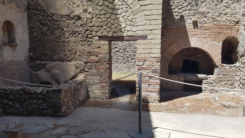 VII.1.46 Pompeii. August 2023. Looking towards north side of kitchen/bakery area. Photo courtesy of Maribel Velasco.