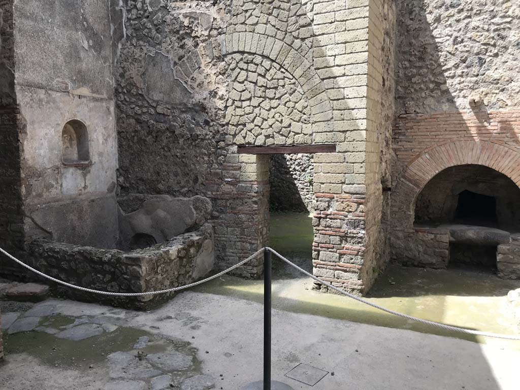 VII.1.46 Pompeii. April 2019. Looking towards north side of kitchen area.
Niche and basin, on left, doorway to room 13, in centre, and oven in kitchen room 12, on right.
Photo courtesy of Rick Bauer.
