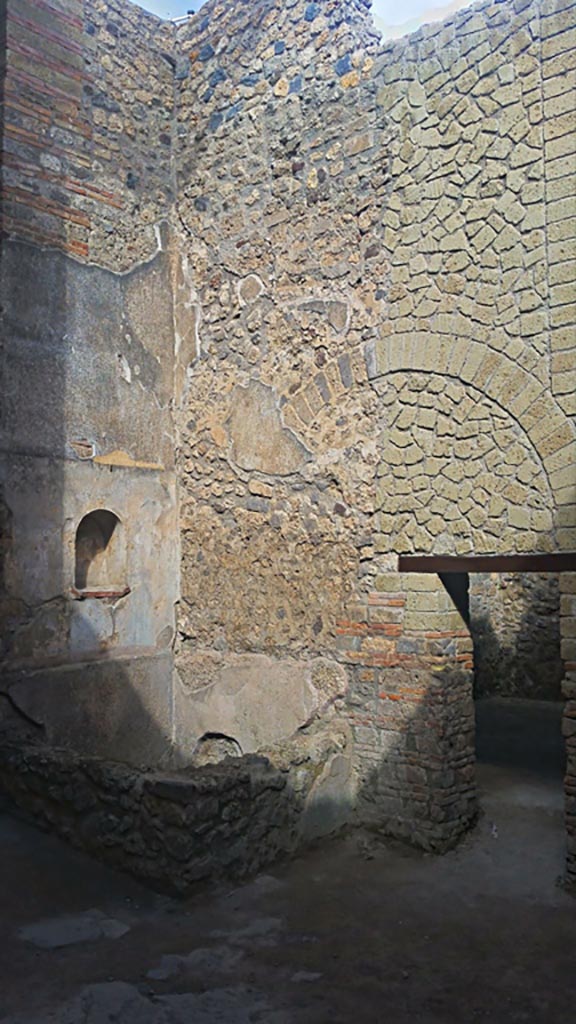 VII.1.46, Pompeii. May 2017. 
Looking north-west across kitchen area 12 to niche lararium 14 built into west wall above a basin/tank.
On the right is the doorway into room 13. Photo courtesy of Giuseppe Ciaramella.


