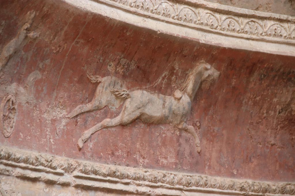 VII.5.24 Pompeii. October 2023. Frigidarium, detail of plasterwork showing a cupid on a two-horse chariot. Photo courtesy of Klaus Heese.