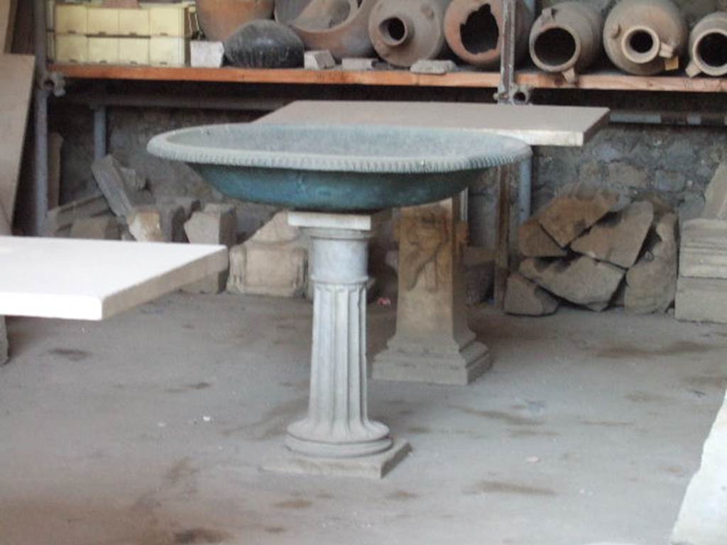 VII.7.29 Pompeii. May 2006. Monopodium basin and table in storage.