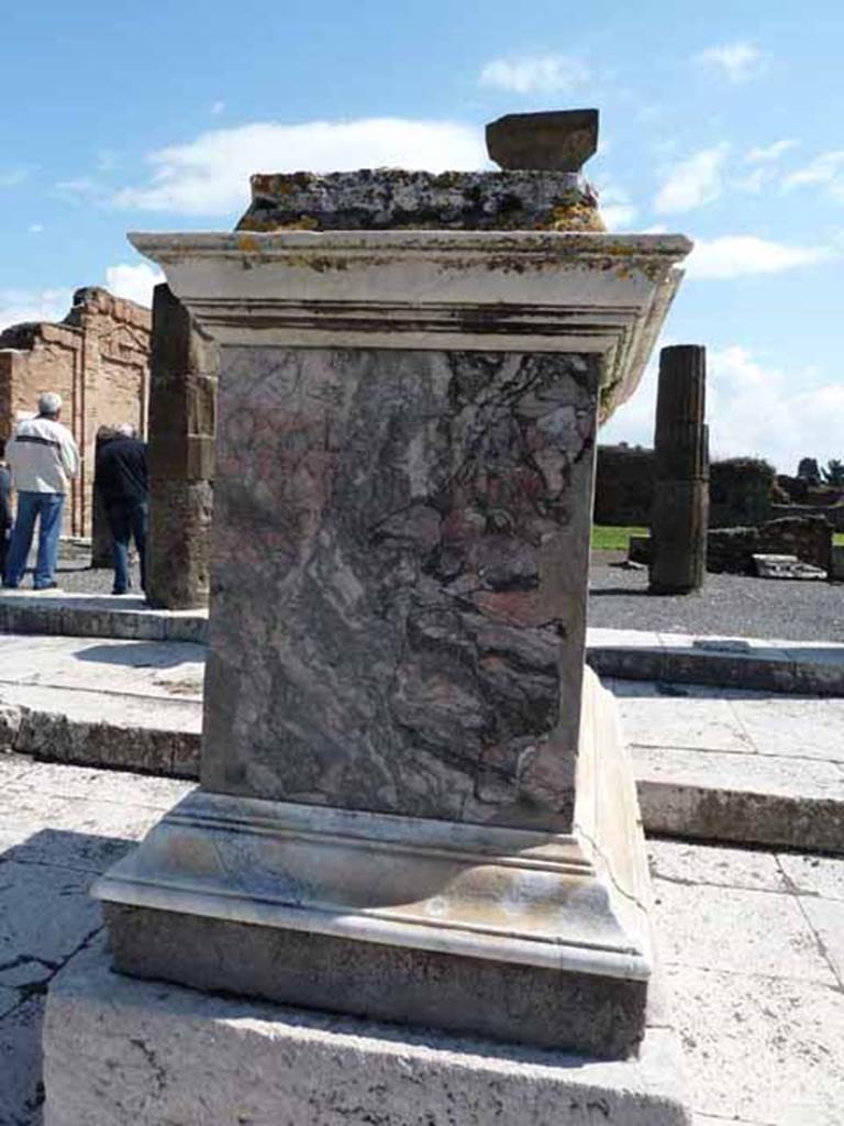 VII.8 Pompeii Forum. May 2010. West side of marble statue base with inscription, in the south-east corner.