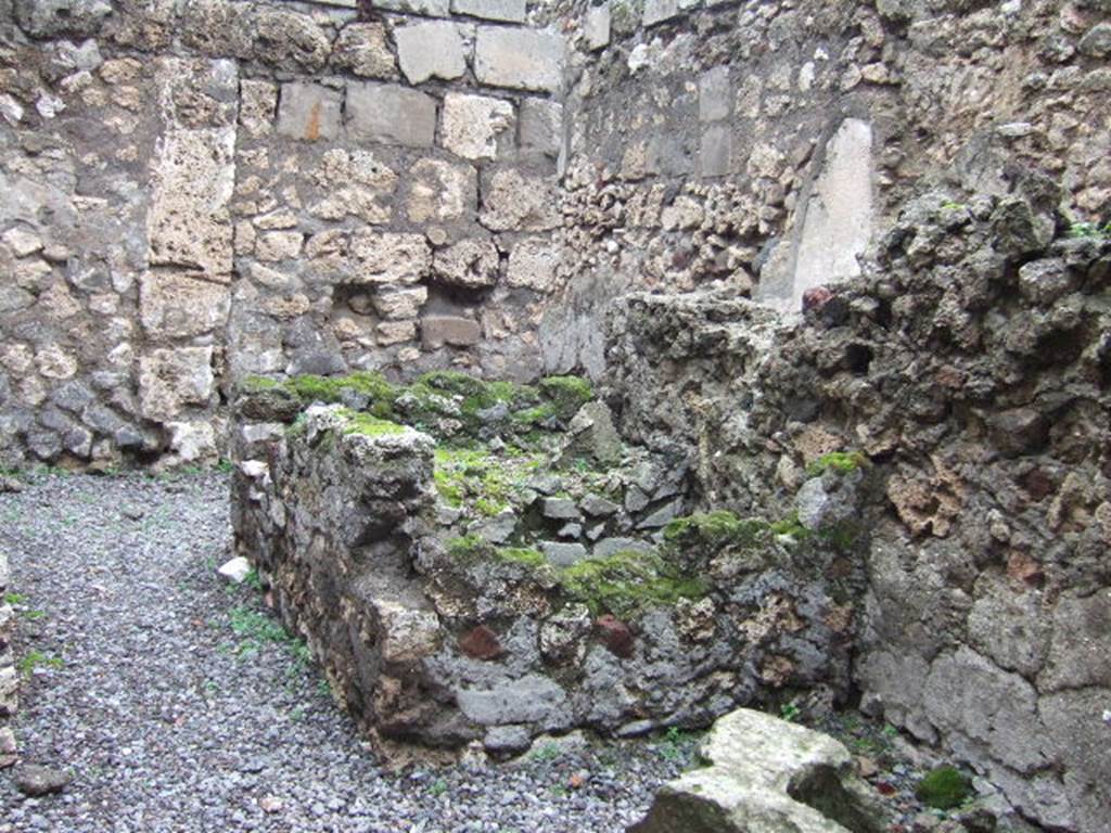VII.9.41 Pompeii. December 2005. Remains of two masonry basins or vats on east side of workshop. 
