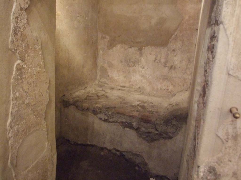 VII.12.18 Pompeii. December 2006. Doorway into prostitute’s room with stone bed.

