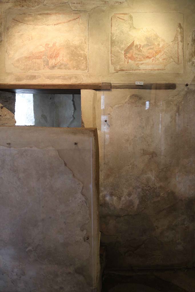 VII.12.18, Pompeii. December 2018. Doorway to the latrine at the west end, behind the screen. 
Photo courtesy of Aude Durand.

