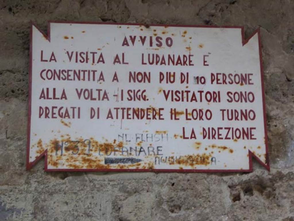 VII.12.18 Pompeii. October 2014. Tabella ansata.
Be advised. 
The visit to the Brothel is allowed by not more than 10 persons at a time - gentlemen. Visitors are asked to wait their turn. 
No flash.

I SIGG. – (Signori=Gentlemen) may be a left-over from the days when only men were deemed suitable to enter and see the brothel. 
The women in the group were left to while away the time in the Forum, while the men were taken away to see the “sights”!).
