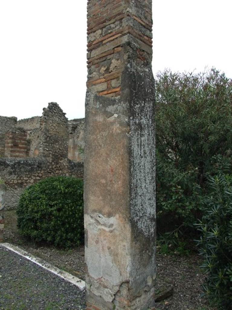 VII.14.5 Pompeii.  March 2009. Room 11. Peristyle garden area.  East end. Looking north. One of three pillars that supported the Portico.