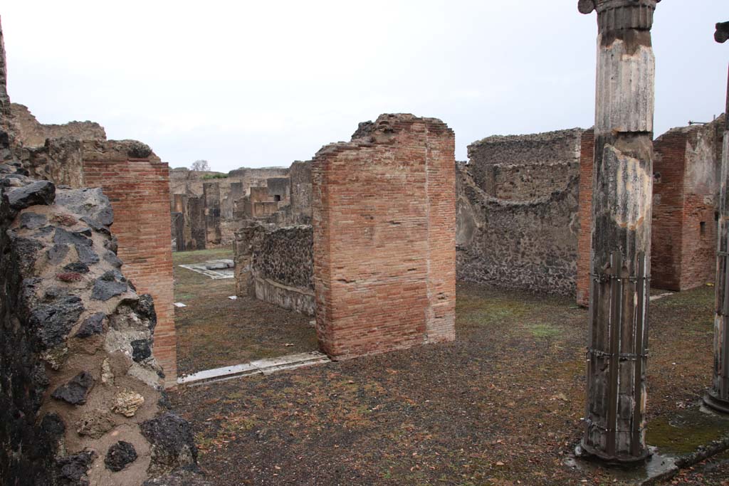 VIII.5.2 Pompeii. October 2020. Looking north from west portico towards doorway to room 6 in north-west corner of portico, on left.  
The doorway to the tablinum is to the right of centre. Photo courtesy of Klaus Heese.
