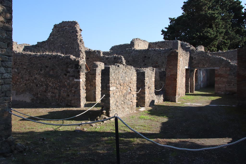 VIII.5.16 Pompeii. October 2022. Looking north-east across portico, with room 1, triclinium, on left. Photo courtesy of Klaus Heese. 
