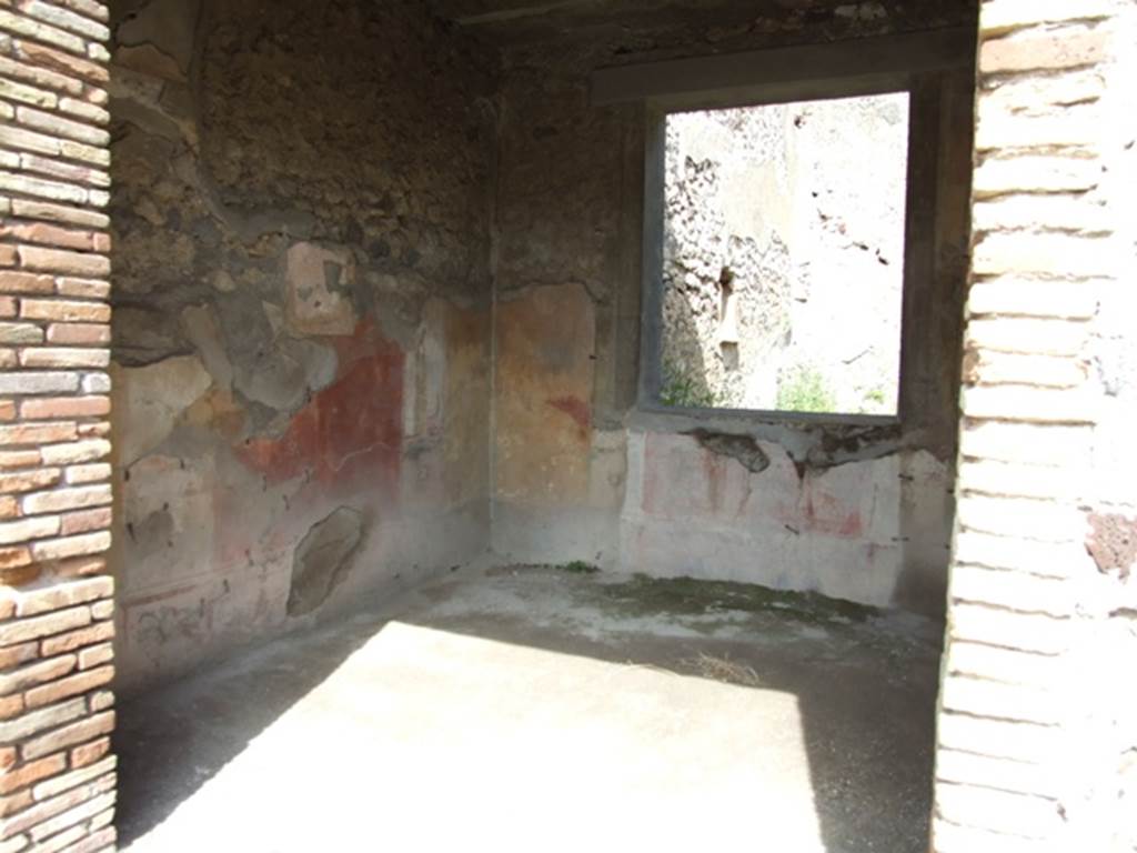 IX.2.5 Pompeii. March 2009. Doorway to triclinium, looking towards north-east corner, and window to garden in east wall. In this room, the zoccolo would have been black, the central panel on the walls was red, the side panels were yellow. According to Sogliano, the paintings found in this room were  Ariadne abandoned (p.97, no.535), A bust of Paris wearing a green heat, with cupid on his right shoulder (p.105, no.558), A bust of Helen, turning to the left, in response to no.558, faded and vanishing (p.108, no.567), Cimone and Perona (p.121, no.599) now in Naples Museum, inv. no: 115398.
See Sogliano, A., 1879. Le pitture murali campane scoverte negli anni 1867-79. Napoli: Giannini. 


