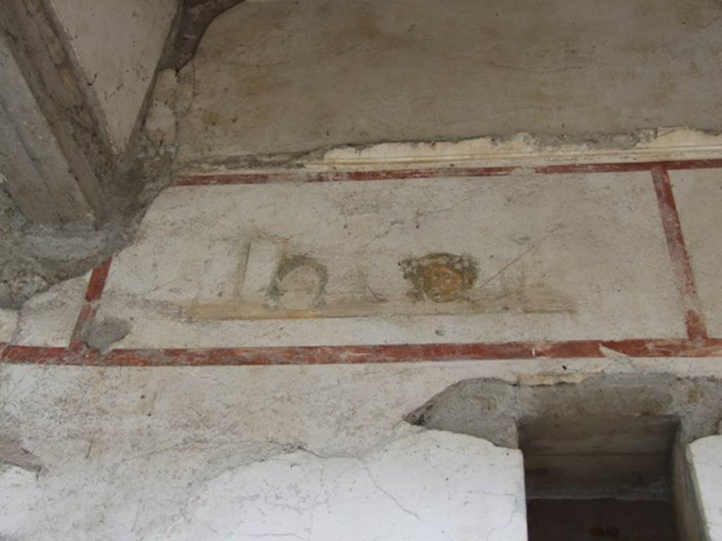 IX.13.1-3 Pompeii. March 2009. Room 9, upper level on north wall of north portico, above the doorway to room 12.