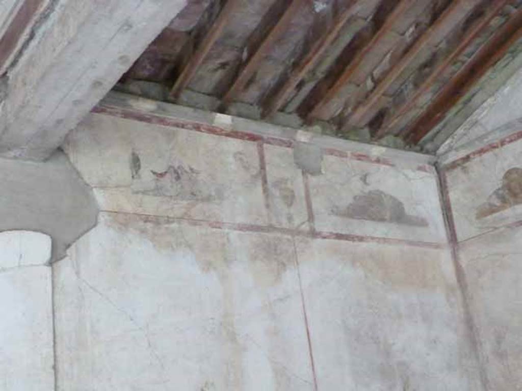 IX.13.1-3 Pompeii. May 2010.  Room 9, south east corner, paintings.