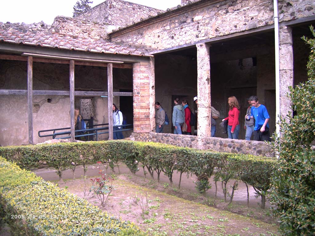 Villa of Mysteries, Pompeii. April 2005. The viridarium/garden in the north-west corner. 
Looking south-east along the north portico of the garden, on right. Photo courtesy of Klaus Heese.
