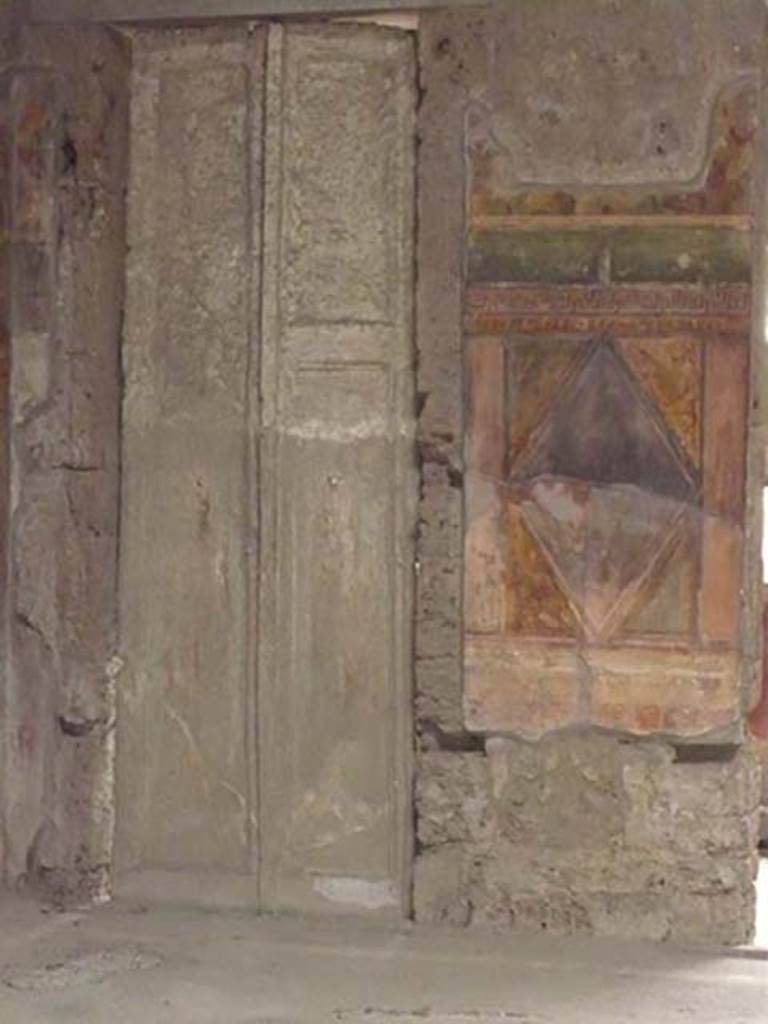 Villa of Mysteries, Pompeii. May 2012. Room 64, cast of door in north-east corner.
Photo courtesy of Buzz Ferebee.
