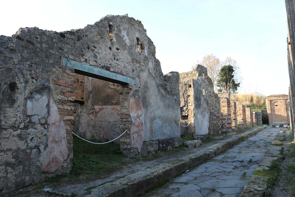 Vicolo dei Vettii between VI.15 and VI.16. December 2018. 
Looking north from VI.15.11, on left, towards VI.15.18, in centre near water tower at end of vicolo. Photo courtesy of Aude Durand.
