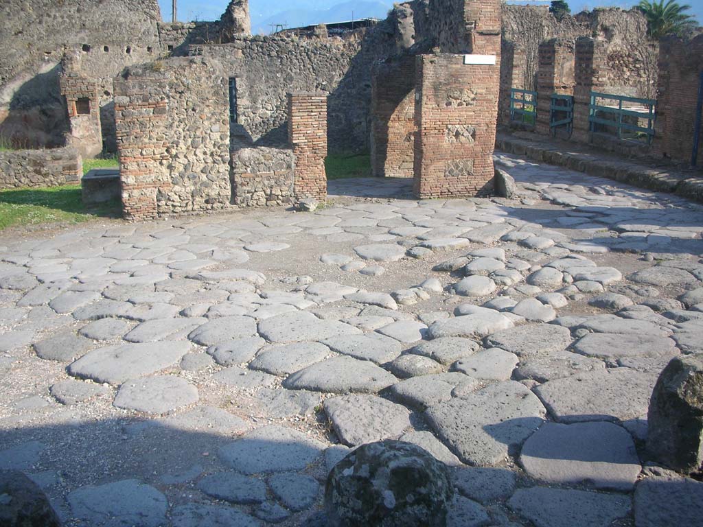 Vicolo dei Vettii Pompeii, on right. May 2010. Looking south from water tower. Photo courtesy of Ivo van der Graaff.