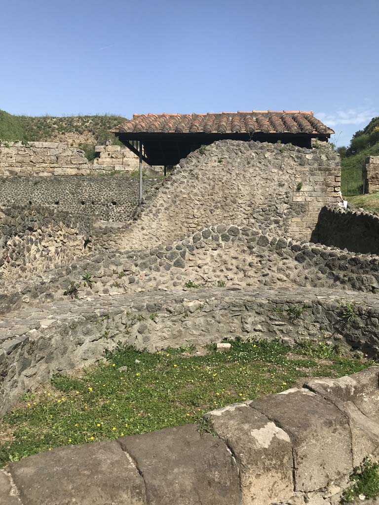 Pompeii Porta Nocera. April 2019. 
Looking north into semi-circular area near plaster casts of victims on north-west side of Via delle Tombe. 
Photo courtesy of Rick Bauer.

