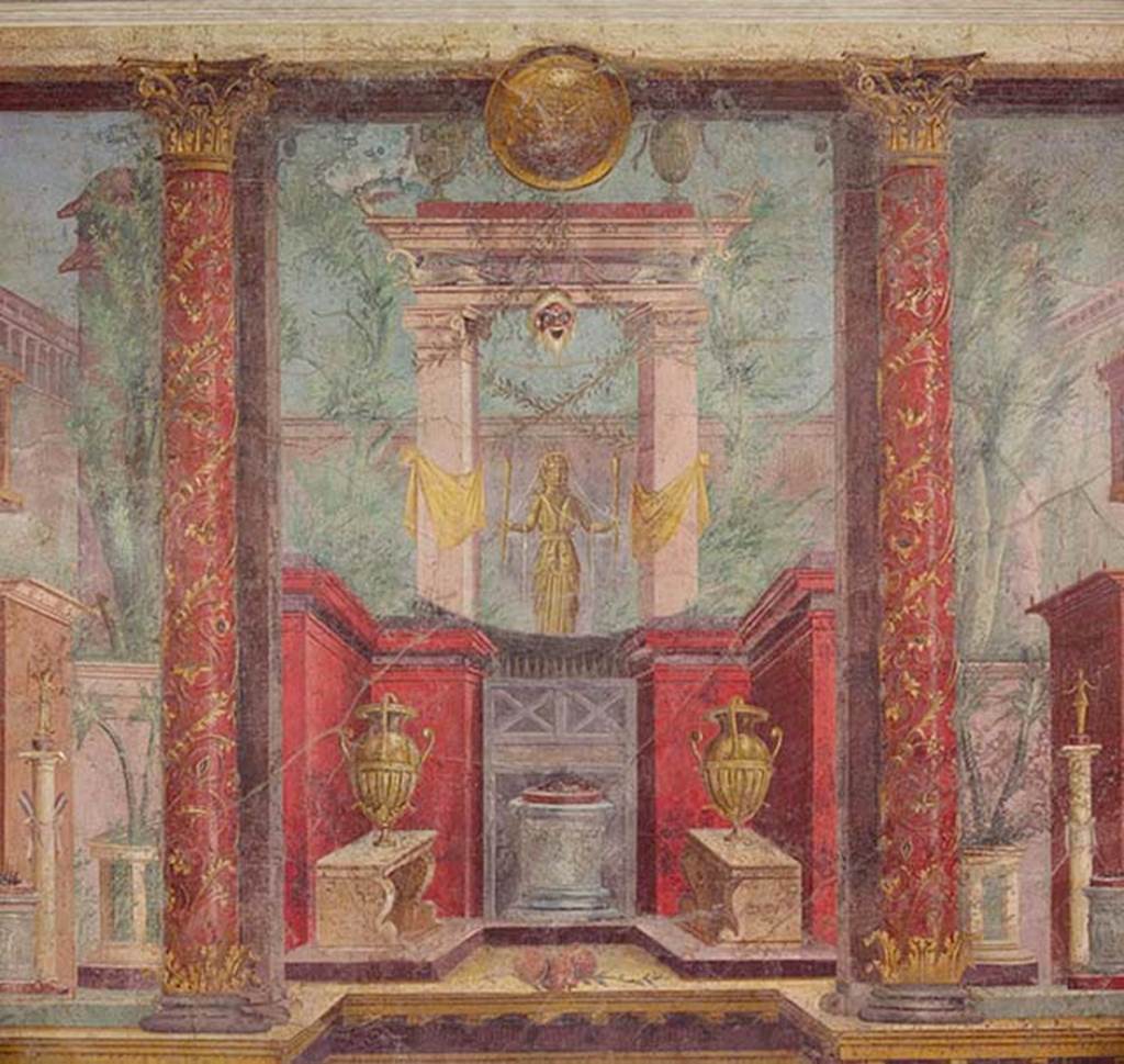 Villa of P Fannius Synistor at Boscoreale. Cubiculum M, second panel from south end of west wall. According to Barnabei, this wall painting depicts a golden statue of Diana Hecate bearing torches. She was the goddess who scattered her benefits on the end of life on those who protected it. She welcomed them, in peace underground, among the ranks of the blessed in the happiness of Elysium. In the painting she has a gold crown with serpents heads and necks on the top. Her chest was crossed by a white band to which was attached the quiver, visible behind the right shoulder. She is within a sacred portal wrapped in yellow ribbons. From the portal hangs a bearded mask of an old silenus above which a lintel is supported on the wings of two swans. On top of the lintel are two silver urns and between them is a round gold shield. At the base is a small red walled area with an altar with offering on top and two vases on benches. Either side are red columns painted with flowers and climbers. See Barnabei F., 1901. La villa pompeiana di P. Fannio Sinistore. Roma: Accademia dei Lincei. p.74, Fig. 17.