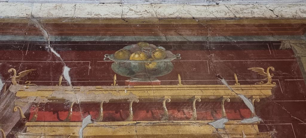 Oplontis Villa of Poppea, January 2023. 
Room 23, upper north wall with still-life of a glass bowl full of pomegranates. Photo courtesy of Miriam Colomer.

