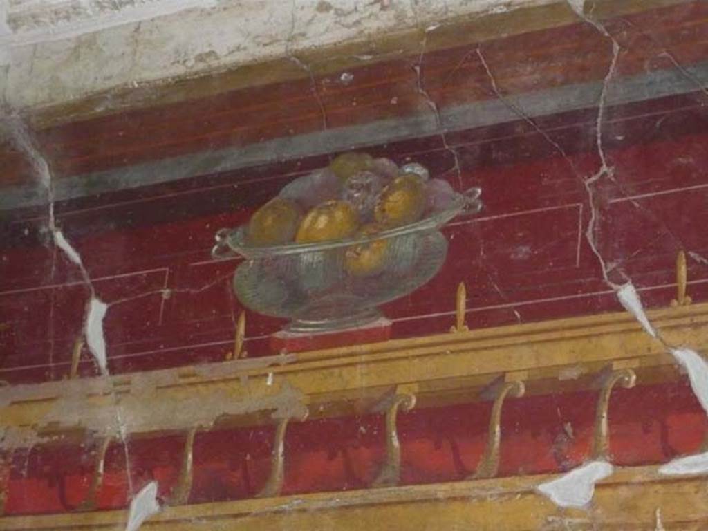 Oplontis, May 2010. Room 23, painted wall with still-life of glass bowl with pomegranates, from north wall.  Photo courtesy of Buzz Ferebee.
