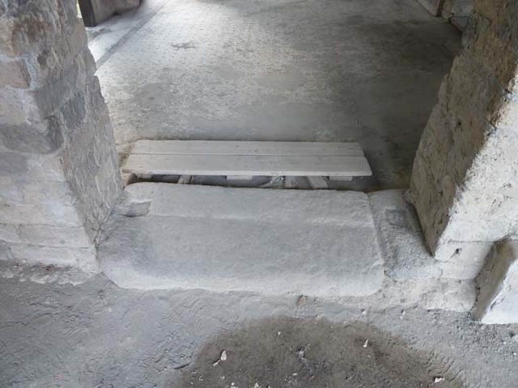 Oplontis, September 2015. Portico 24, threshold to doorway at east end, actually in the west wall of Portico 40.