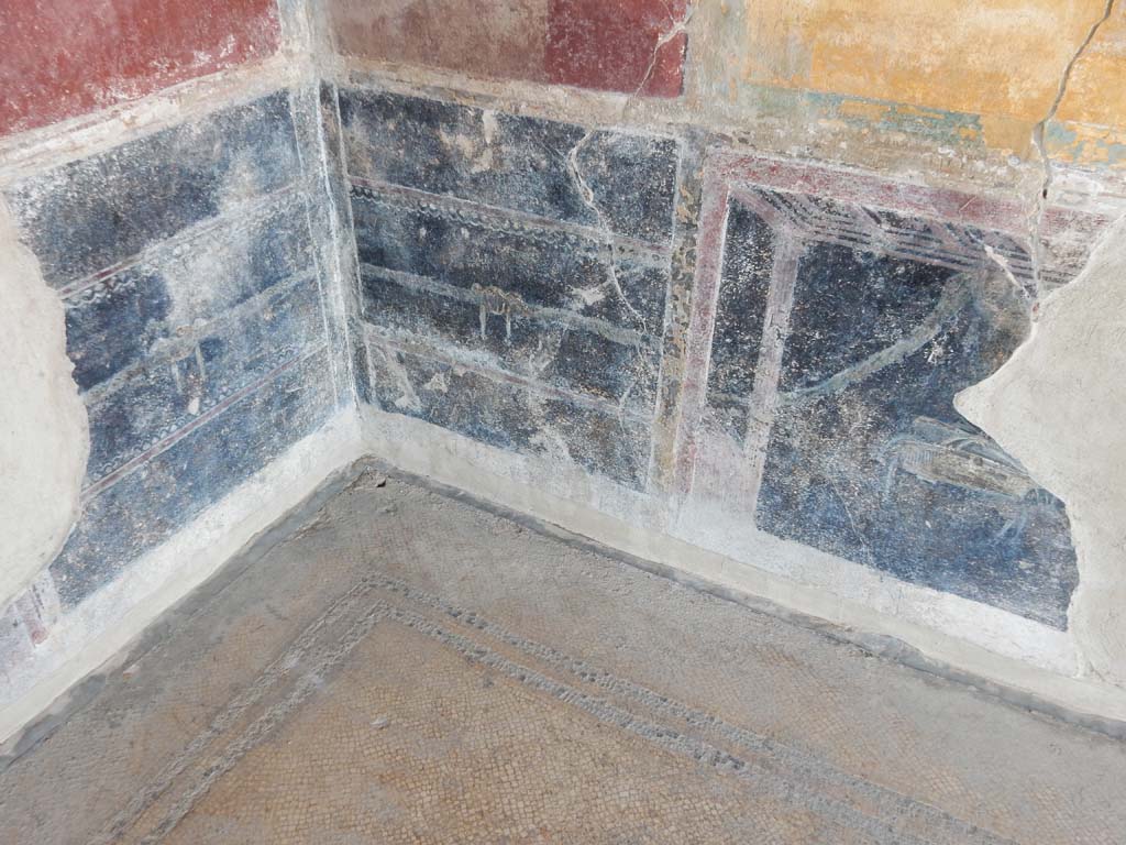 Stabiae, Villa Arianna, June 2019. Room 7, detail of zoccolo decoration in south-west corner.
Photo courtesy of Buzz Ferebee.

