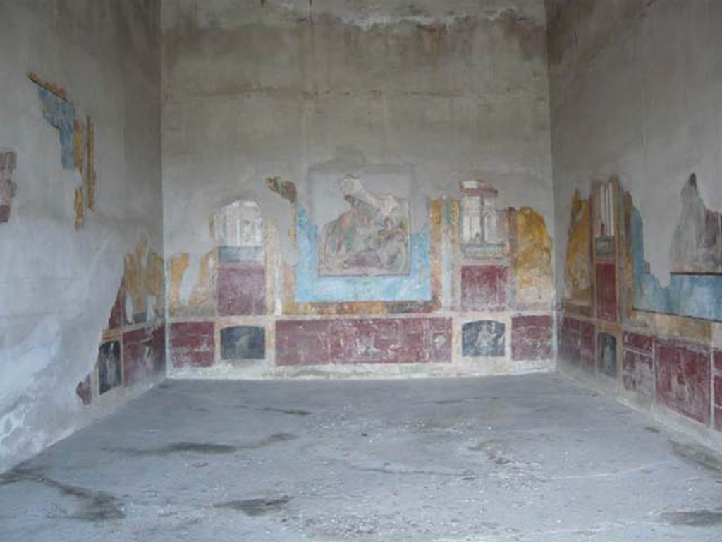 Stabiae, Villa Arianna, May 2010. Room 3, south wall. Photo courtesy of Buzz Ferebee.
The central painting shows Dionysus just arrived at Naxos, where he lovingly glimpses Ariadne asleep. 
