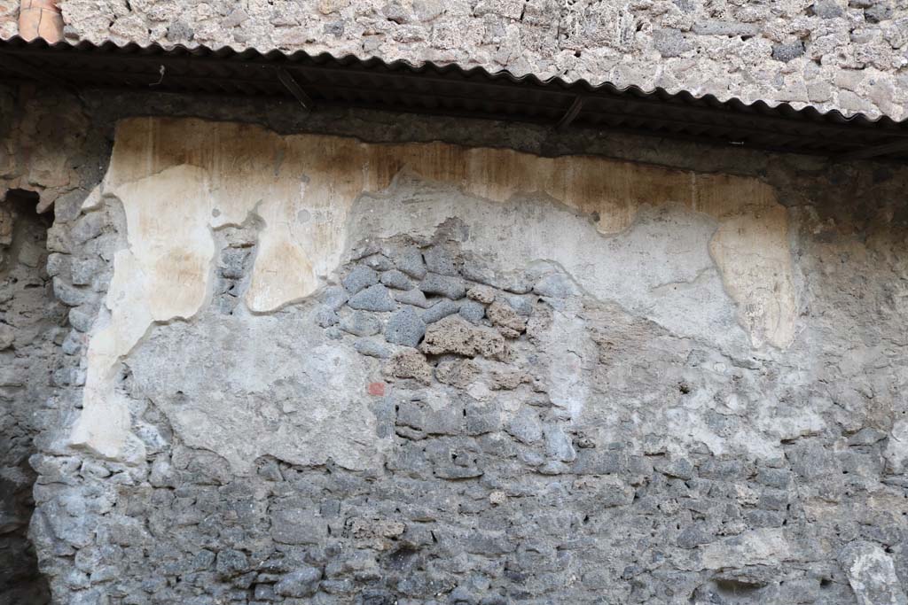 Pompeii Street Altar at I.8.1. December 2018. Remains of plaster and painting on south side of altar. Photo courtesy of Aude Durand.