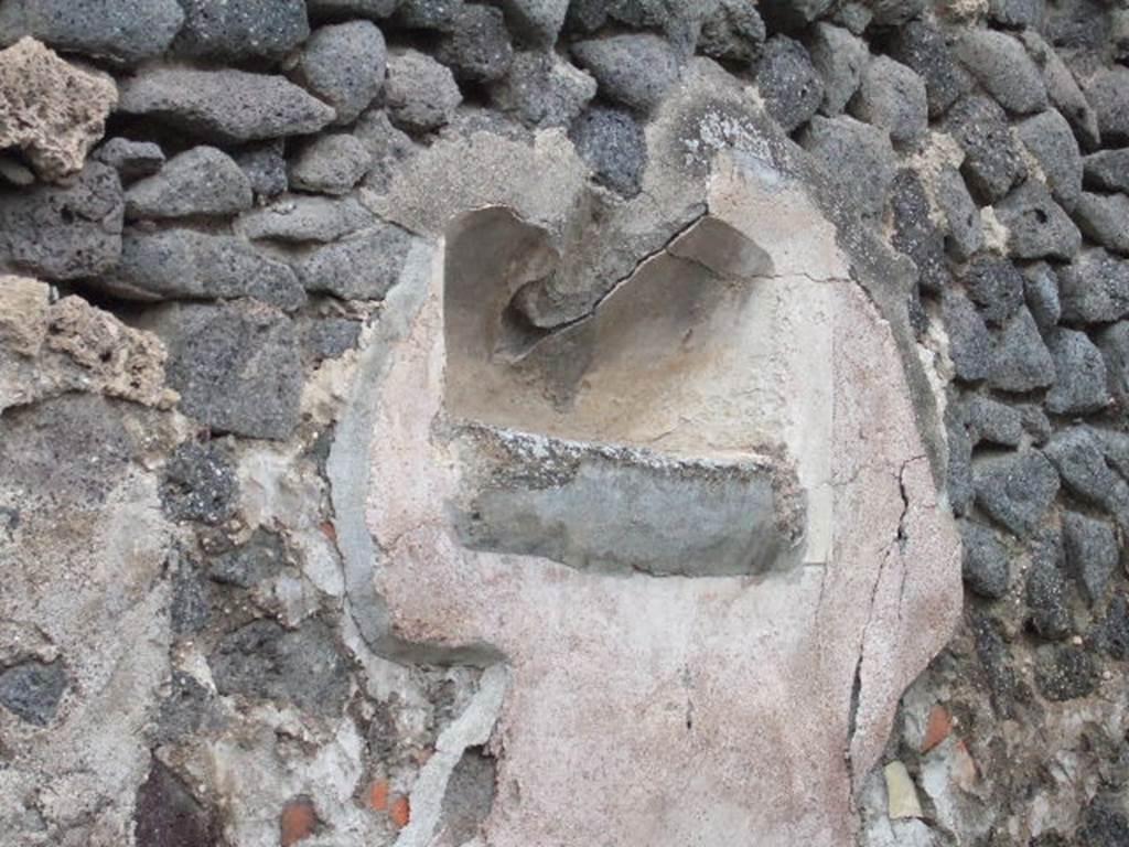 Street shrine at IX.2.12, with remains of niche on north wall. December 2007.