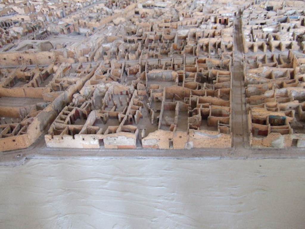 IX.2.19 Pompeii. East side of insula IX.2. Street shrine on west side of Vicolo di Tesmo, as shown on model in Naples Archaeological Museum.
