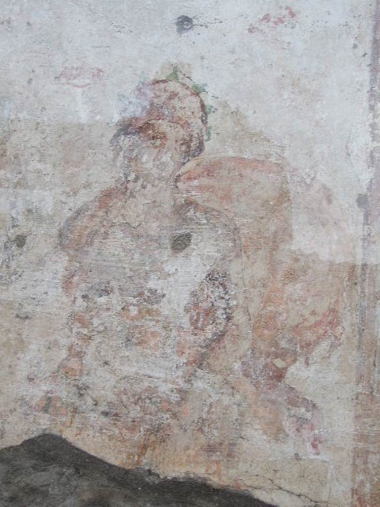 Detail of painted figure, perhaps one of the two Lares, outside IX.11.1.  December 2006. 