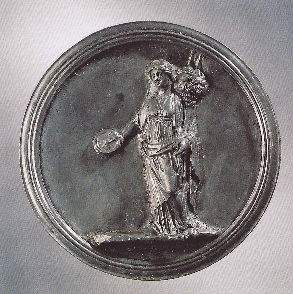 Victim numbered 4. Silver medallion found with victim. Fortuna with a cornucopia and a patera in her extended right hand.
Now in Naples Archaeological Museum. Inventory number 25489.