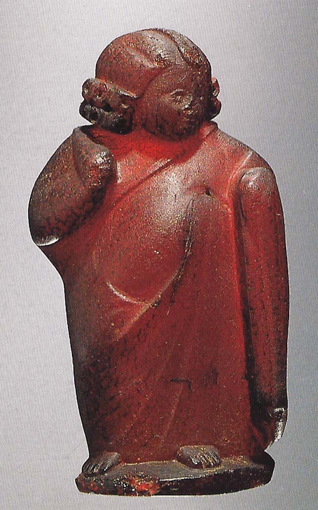 Victim numbered 4. Amber statuette of a young boy or cupid with a head of curls and wrapped in a cloak.
Now in Naples Archaeological Museum. Inventory number 25813