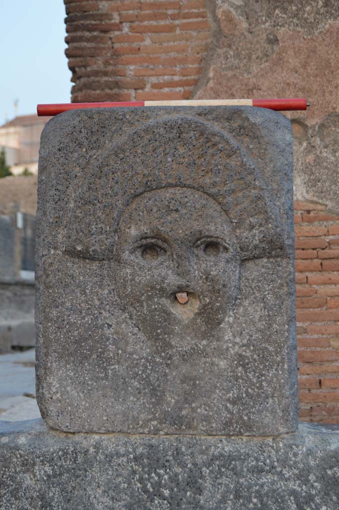 Fountain outside I.4.15 on Via Stabiana. October 2017. Relief of comedy mask.
Foto Taylor Lauritsen, ERC Grant 681269 D�COR.

