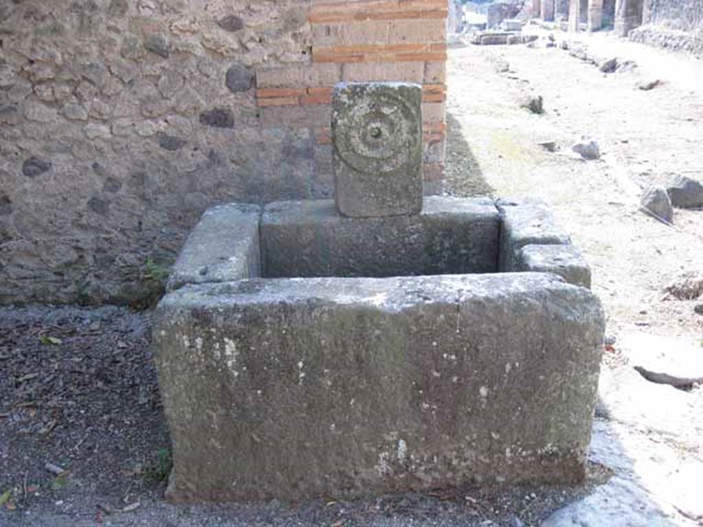 Fountain at corner of I.5.2, Pompeii.  Looking west along Vicolo del Conciapelle, toward Via Stabiana. Photo courtesy of Drew Baker. September 2010.


