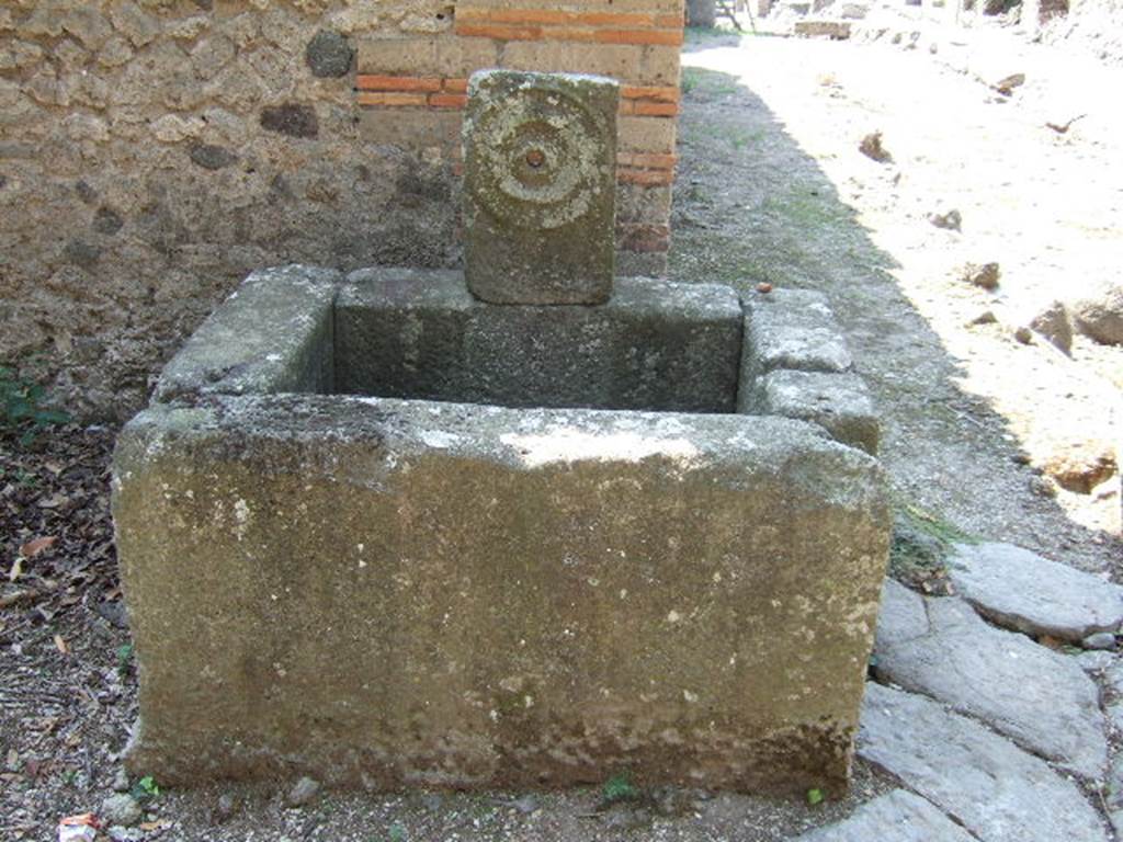Fountain outside I.5.2, Pompeii. September 2005. Relief of �patera� or plate.