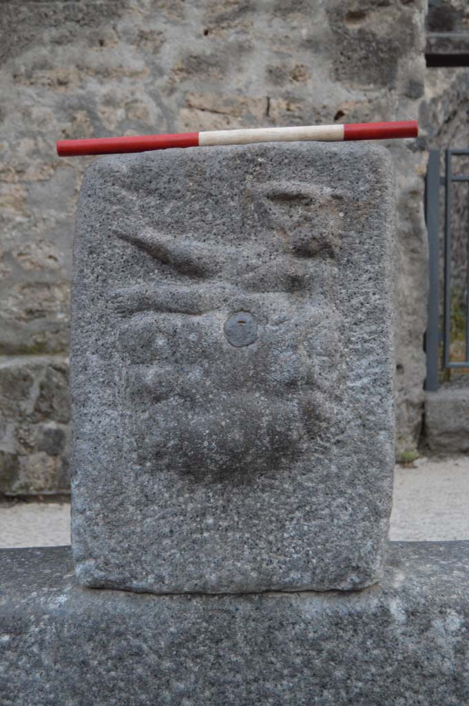 Fountain outside I.12.2 on Via dell’ Abbondanza. October 2018. 
Fountain head with relief of Satyr on rock-fountain or water source.
Foto Taylor Lauritsen, ERC Grant 681269 DÉCOR.
