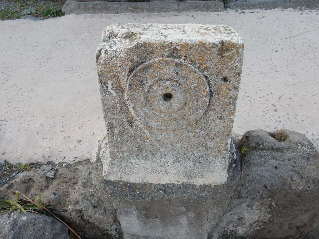 V.1.3 Pompeii. June 2019. Looking north at fountain between V.1.3 and V.1.4. with detail of relief of �patera� or plate.
Photo courtesy of Buzz Ferebee.
