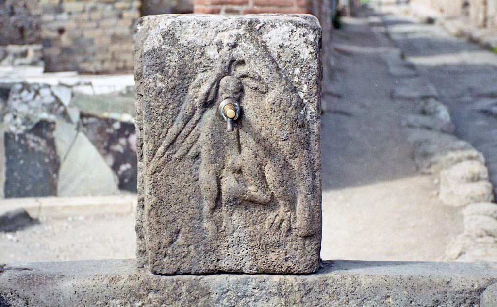 Fountain outside VI.3.20, Pompeii. October 2001. Detail on fountain of eagle and hare. Photo courtesy of Peter Woods.