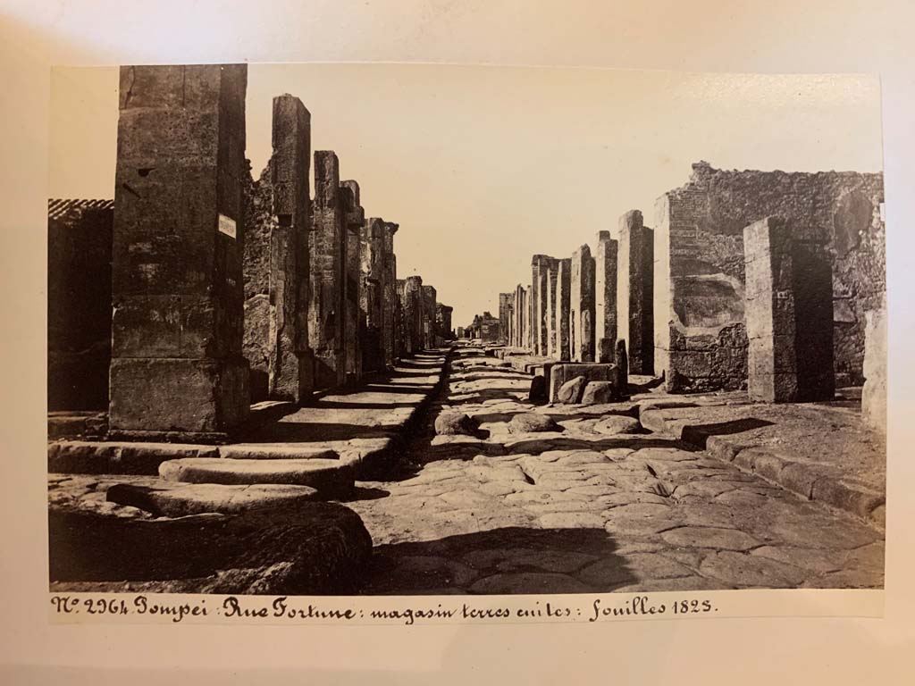 Fountain outside VI.13.7.  Via della Fortuna between VII.4 and VI.13, looking west. 
From an album of Michele Amodio dated 1874, entitled �Pompei, destroyed on 23 November 79, discovered in 1745�. 
Photo courtesy of Rick Bauer.
