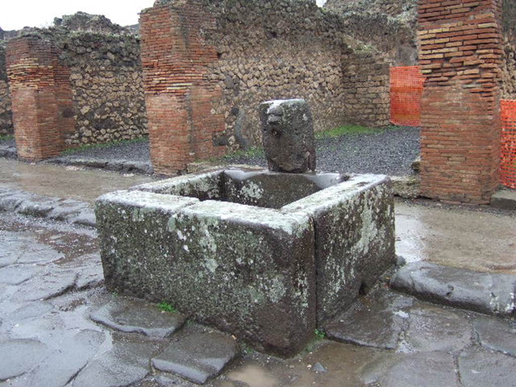 Fountain outside VII.14.13 and VII.14.14 on north side of Via dell�Abbondanza. December 2005.