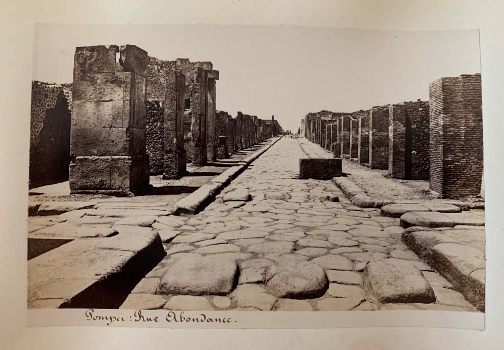 Fountain outside VII.14.13 and VII.14.14 on Via dell�Abbondanza. Album by M. Amodio, c.1880, entitled �Pompei, destroyed on 23 November 79, discovered in 1748�.
Looking west to crossroads with Via dei Teatri, on left, and Vicolo del Lupanare, on right.
Photo courtesy of Rick Bauer.
