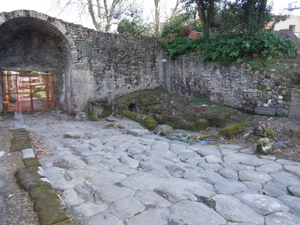 Pompeii Stabian Gate. March 2009. 
North side of gate. Looking south with fountain in centre and drainage, to right of fountain, on west side. 
