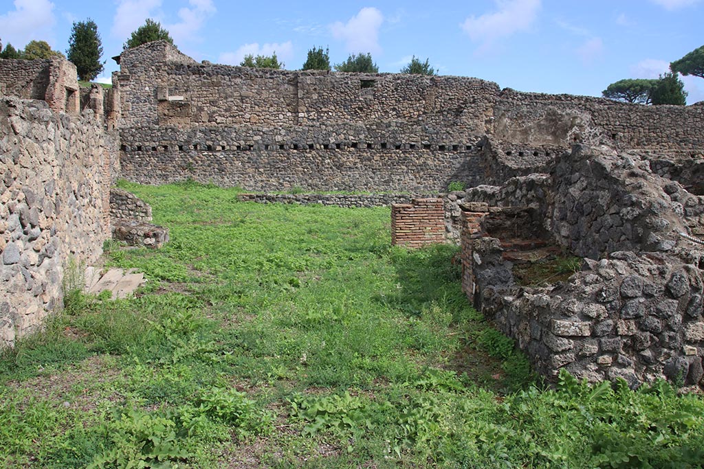 I.1.8 Pompeii. October 2024. Looking east across large entrance room. Photo courtesy of Klaus Heese.